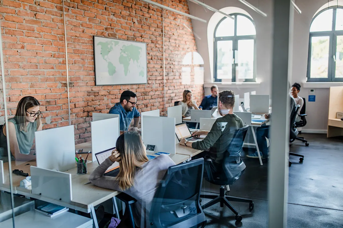 A group of people working in an office.